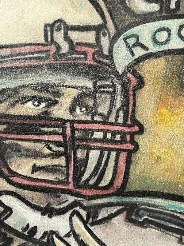 Macro detail of brushwork on a football helmet, acrylic and ink over raw canvas
